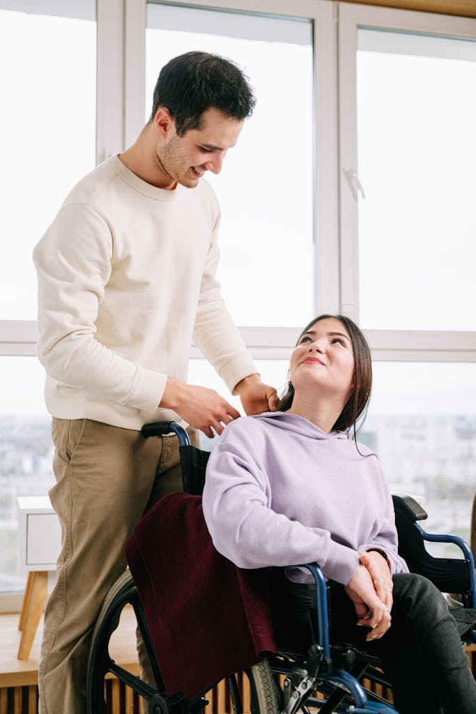 A young couple sharing a moment of care and connection indoors.